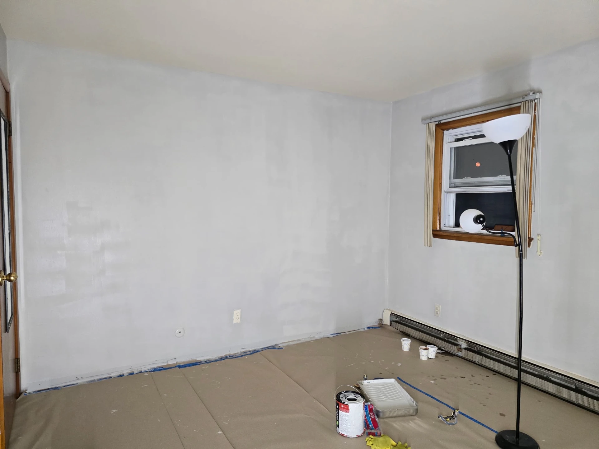 Bedroom walls prepped and primed before painting